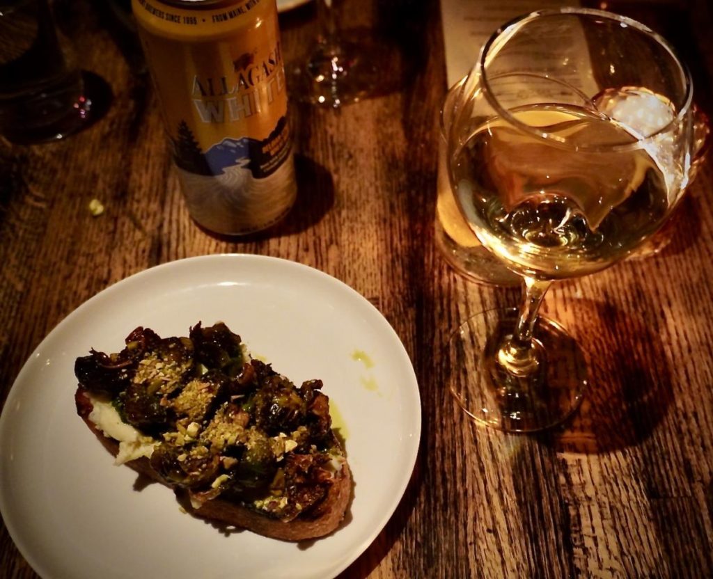 Crispy brussels sprouts on grilled sourdough toast, ricotta, and honey